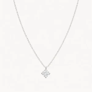 COLGANTE CON DIAMANTE GARRAS ROMBO 0.20 QUILATES PUNTO DE LUZ